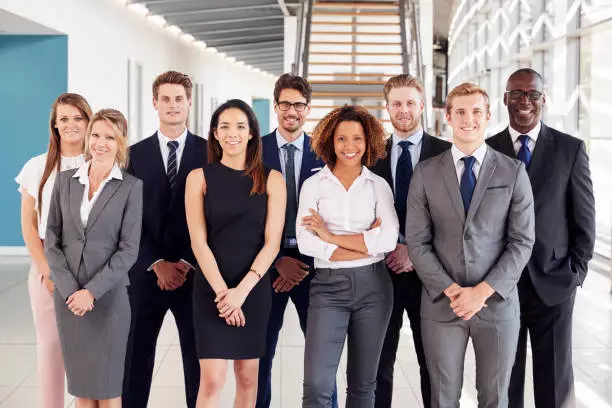 A team of smiling realtors